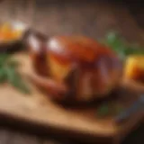 A beautifully glazed roast half duck resting on a wooden board