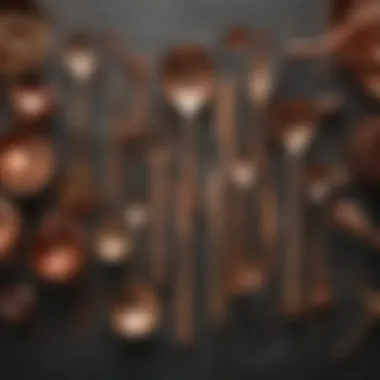 An assortment of cooking utensils made from copper