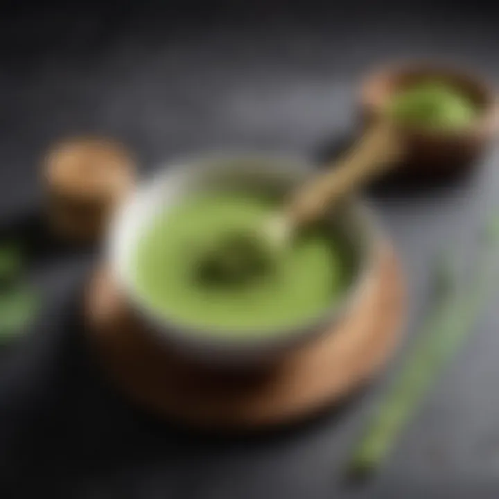 A pristine bowl filled with vibrant matcha powder and a bamboo whisk resting beside it