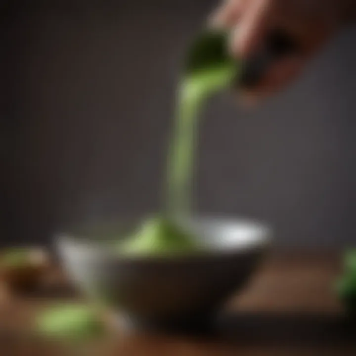 Close-up of matcha tea being whisked to a frothy consistency in a bowl