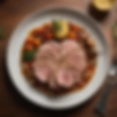 A beautifully garnished plate featuring pork tenderloin and sides