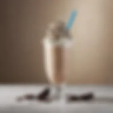 An elegant glass filled with a creamy Oreo shake topped with whipped cream