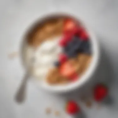 A simple bowl of yogurt with granola and seasonal berries