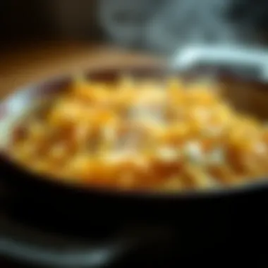 Bubbling Cheesy Shredded Potatoes in a Baking Dish A close-up view of cheesy shredded potatoes bubbling in a baking dish