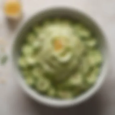 Smashed cucumbers being mixed with a tangy dressing in a modern bowl