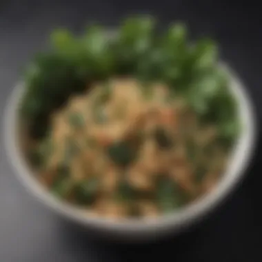 A close-up of a bowl filled with quinoa and dark leafy greens