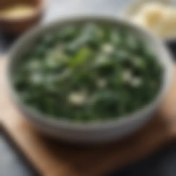 Close-up of sautéed spinach and garlic in an elegant dish.