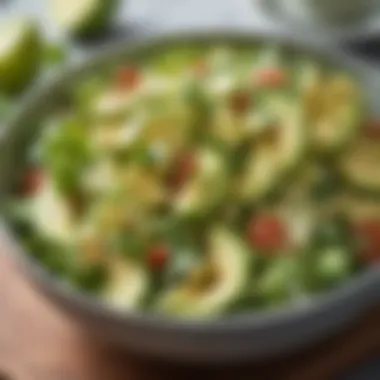 Creamy avocado salad garnished with lime and cilantro