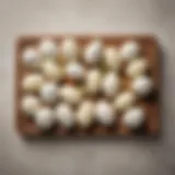 A selection of different mozzarella types arranged on a wooden platter.