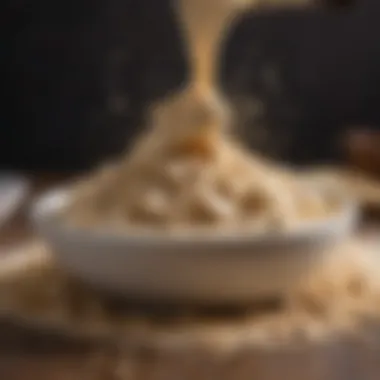 A close-up of protein powder being sprinkled over a bowl of dough.