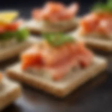 Close-up of a beautifully garnished salmon spread on whole grain crackers.