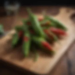 Fresh shishito peppers arranged aesthetically on a wooden board