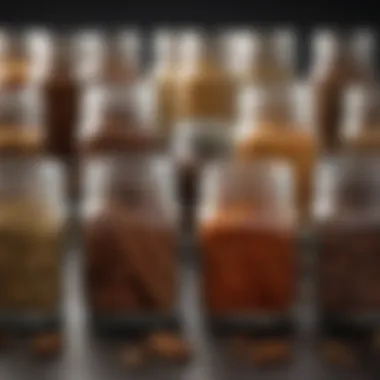 Close-up view of a selection of essential spices in glass containers.