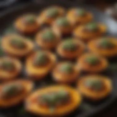 A close-up of roasted sweet potatoes garnished with herbs and spices.