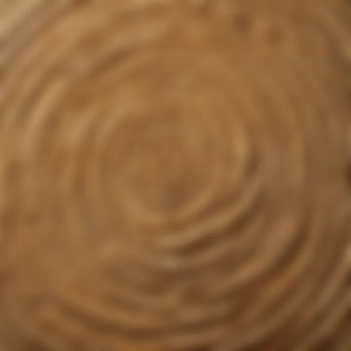 Close-up view of a handcrafted wooden cheese board showcasing intricate grain patterns