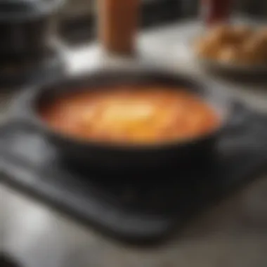 A heat resistant mat used under a hot dish, demonstrating its practical application in protecting surfaces.