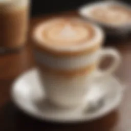 A close-up view of a beautifully crafted Café Latte with intricate latte art on top.
