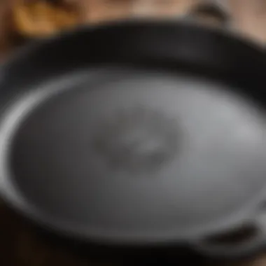 A close-up of a cast iron skillet showing intricate details of its surface and craftsmanship.