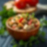 A vibrant bowl of tuna fish sandwich spread adorned with fresh herbs