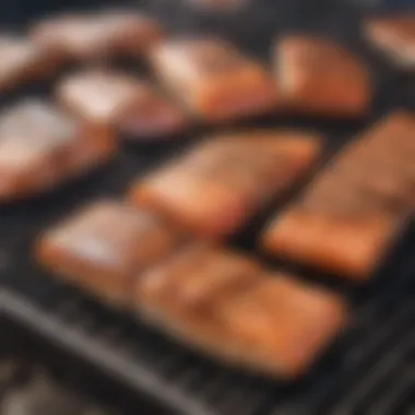 A charcoal grill with salmon fillets sizzling on the grate