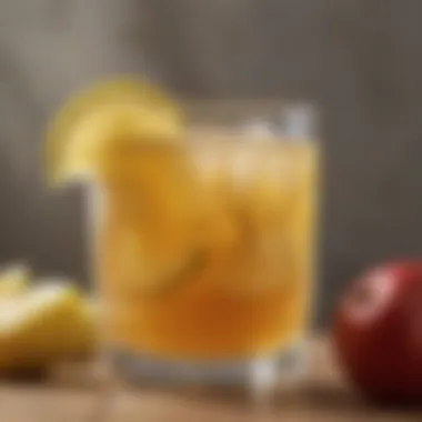 Diluted Apple Cider Vinegar Drink A glass of diluted apple cider vinegar with a lemon slice on the rim