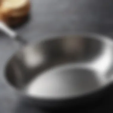 Close-up of a stainless steel sauté pan showcasing its polished surface