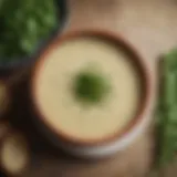 A bowl of creamy leek potato soup garnished with fresh herbs