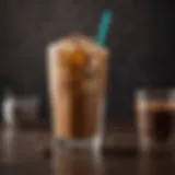 Elegant glass of iced coffee with ice cubes and coffee beans