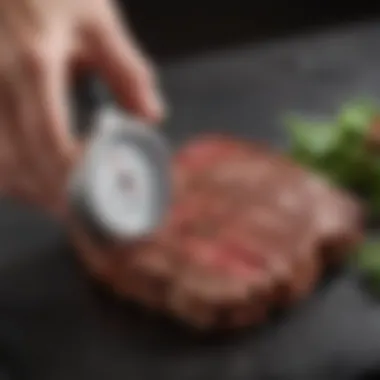 A close-up of a meat thermometer checking steak doneness with precision