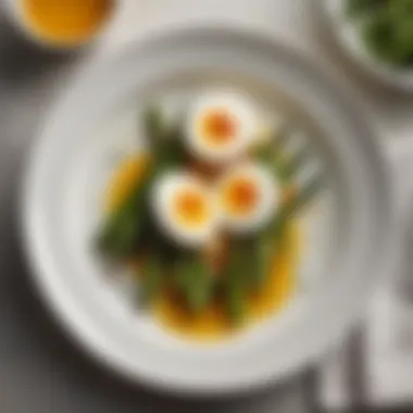 Plate presentation of soft boiled eggs with asparagus