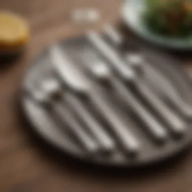 Elegant stainless steel flatware set displayed on a dining table.