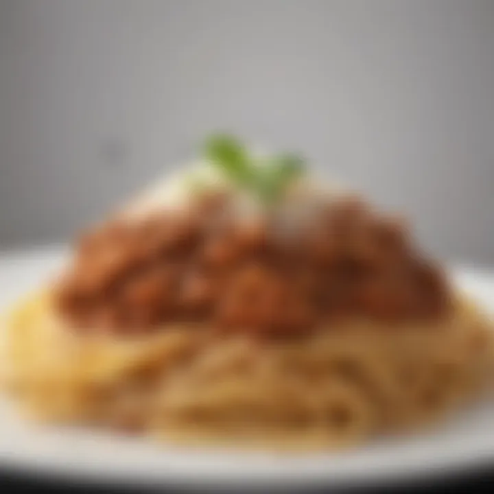 An artful plating of spaghetti bolognese with a sprinkle of parmesan