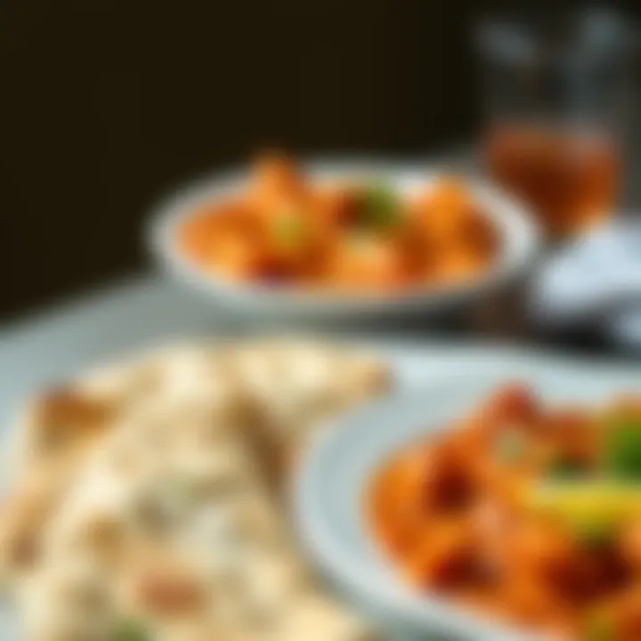 Tikka Masala with Naan A plate of naan bread alongside tikka masala, ready to be enjoyed