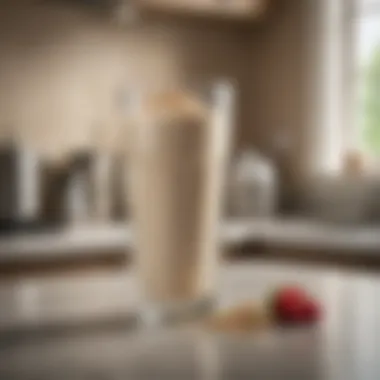 A glass of whey protein shake placed on a kitchen counter