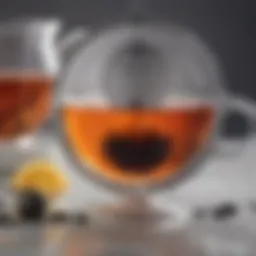 A close-up view of an elegant English tea strainer with drip cup.