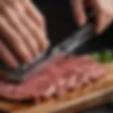 A close-up view of a sharp trimmer cutting through meat fat