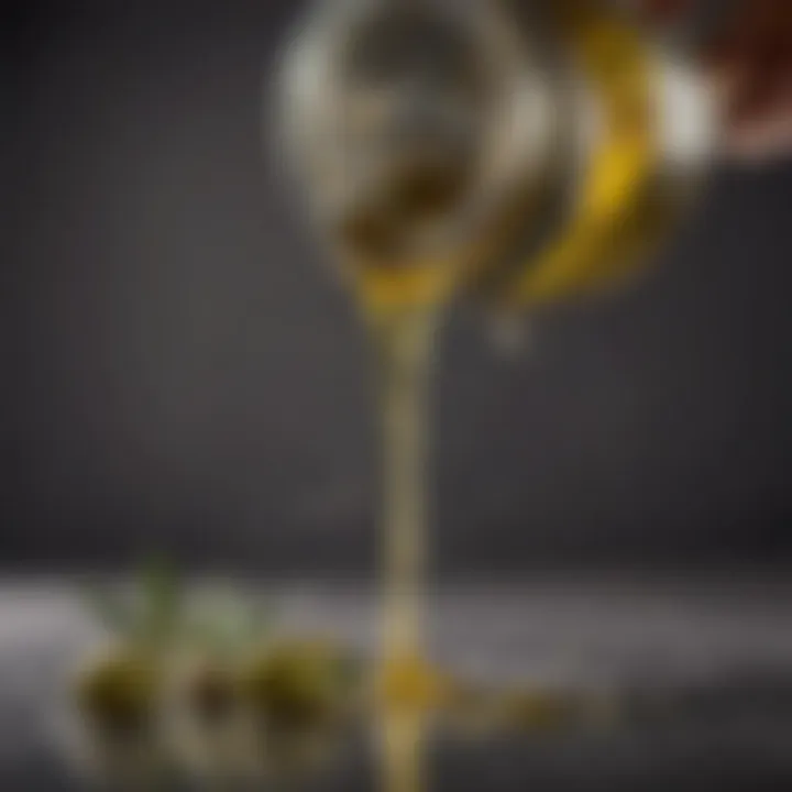 Close-up of olive oil being poured from a dispenser