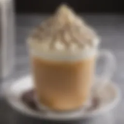 A close-up view of a white mocha coffee topped with whipped cream and chocolate drizzle